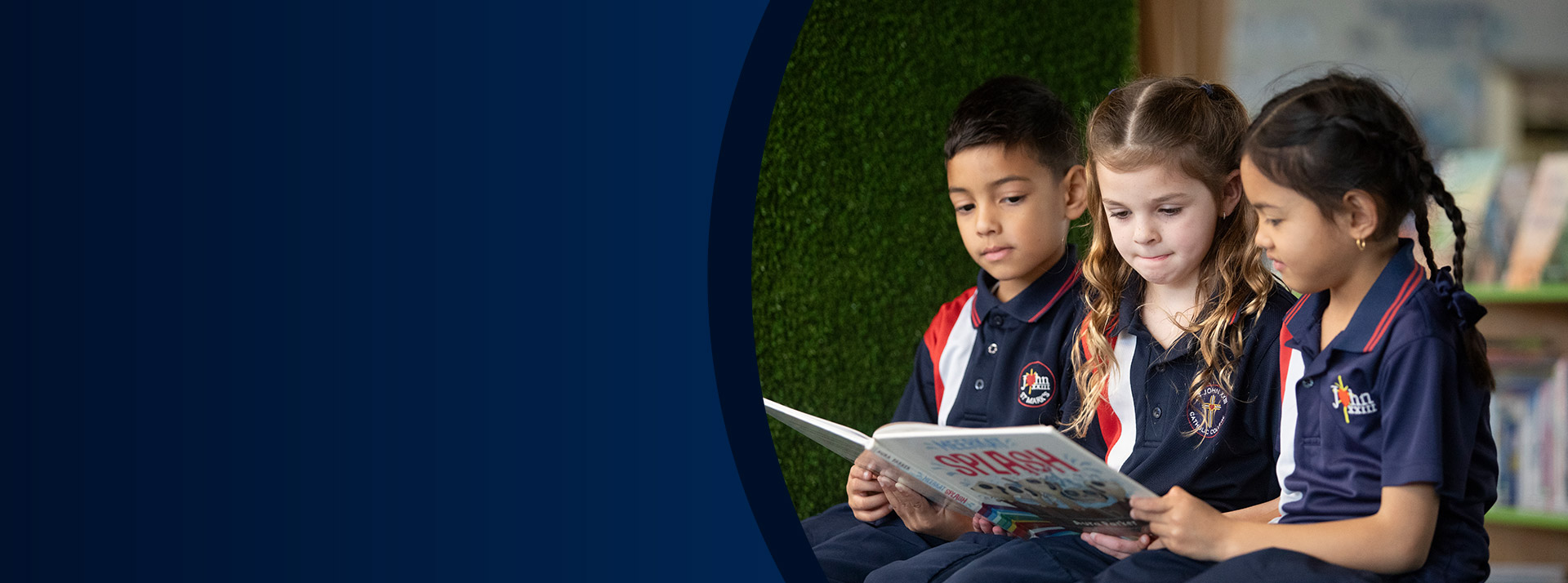 Students reading a book in the library at St John XXIII College Stanhope Gardens