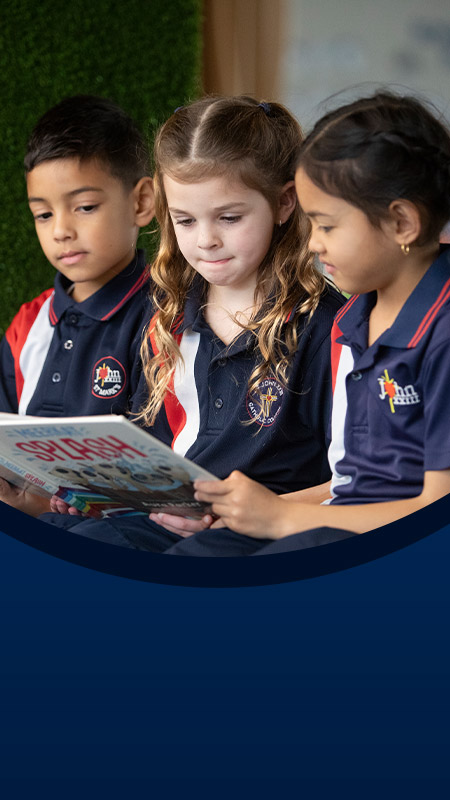 Students reading a book in the library at St John XXIII College Stanhope Gardens