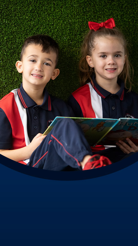 Students reading a book in the library at St John XXIII College Stanhope Gardens