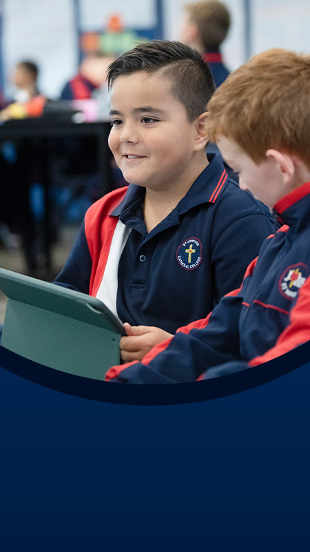 Students on their devices in the classroom at St John XXIII College Stanhope Gardens