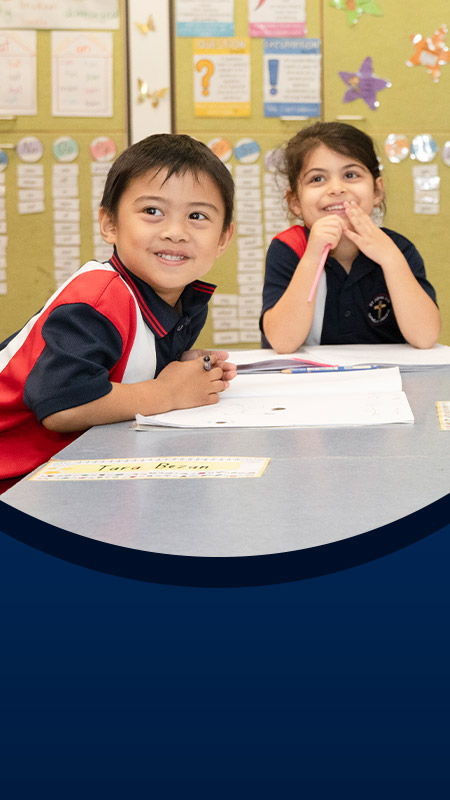 Teacher with her students in the classroom at St John XXIII College Stanhope Gardens