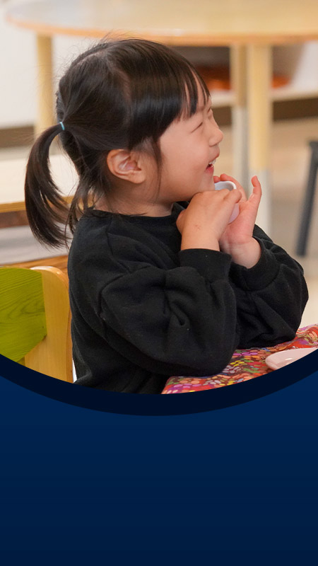 Student with her teacher at the early learning centre at St John XXIII College Stanhope Gardens