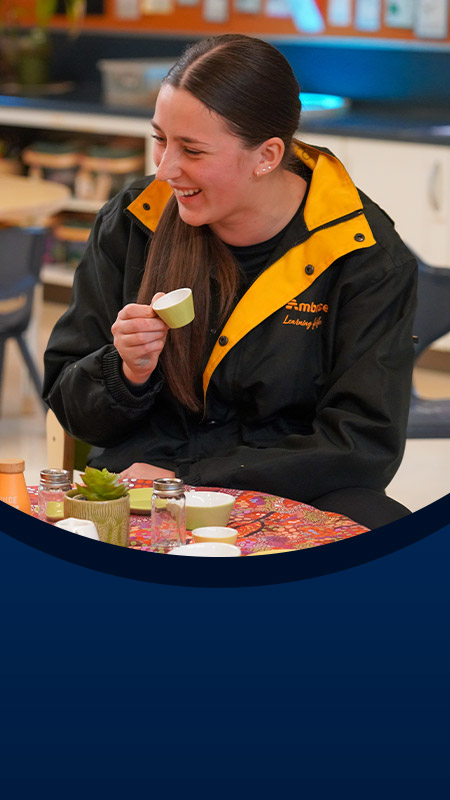 Student with her teacher at the early learning centre at St John XXIII College Stanhope Gardens