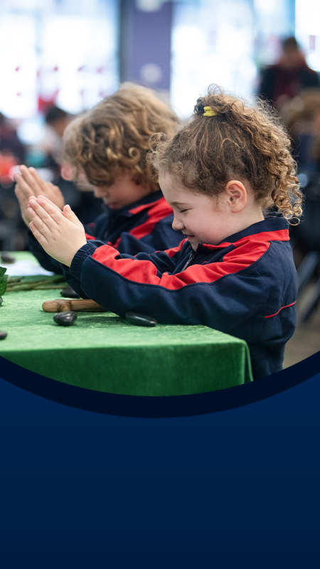 Students praying the Angelus in the classroom at St John XXIII College Stanhope Gardens