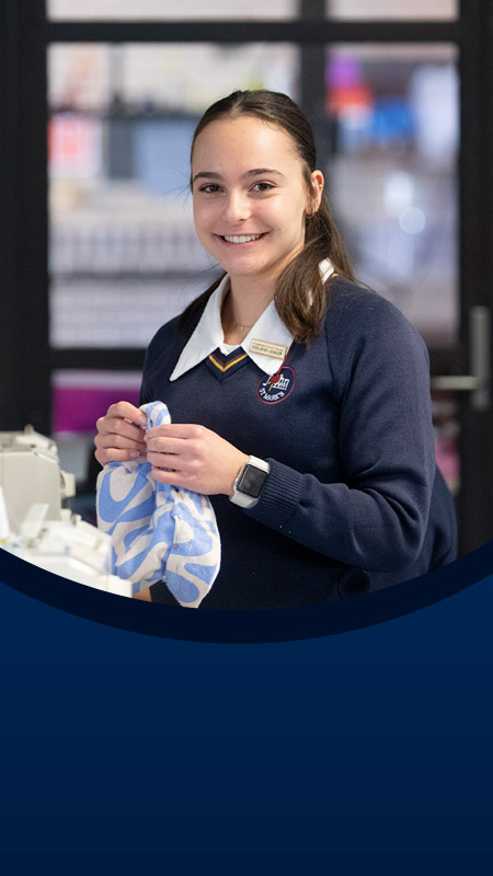 Student sewing in the classroom at St John XXIII College Stanhope Gardens