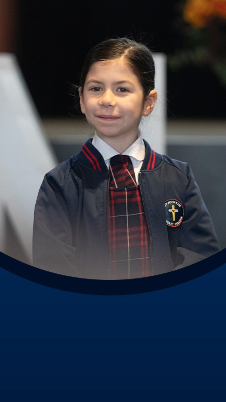Student smiling at a school event at St John XXIII College Stanhope Gardens