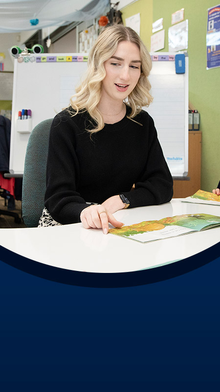 Teacher with her students in the classroom at St John XXIII College Stanhope Gardens