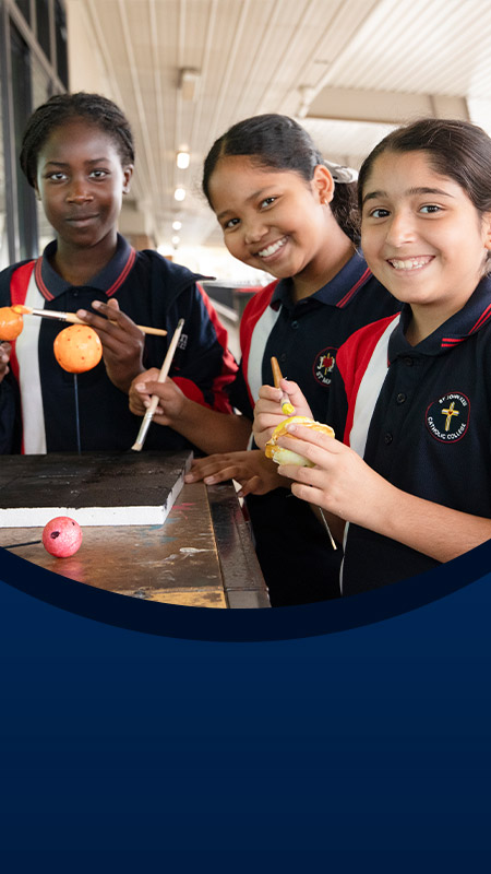 Students painting planets at St John XXIII College Stanhope Gardens