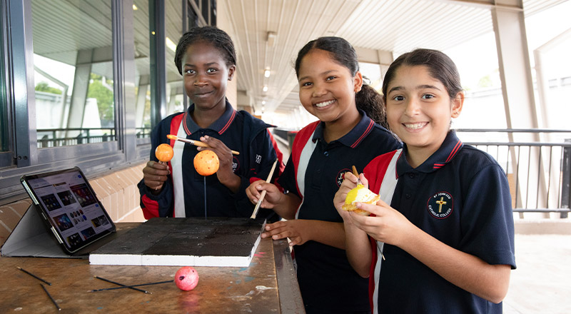 Students painting planets at St John XXIII College Stanhope Gardens