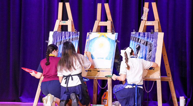 Students painting during a liturgy at St John XXIII College Stanhope Gardens