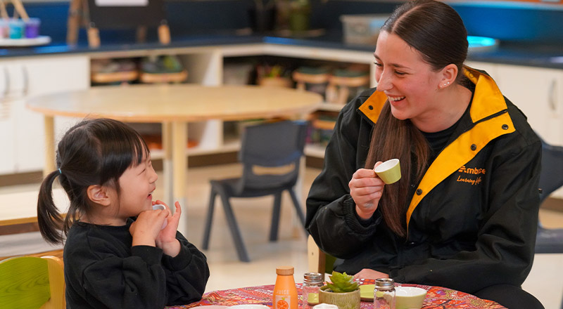 Student with her teacher at the early learning centre at St John XXIII College Stanhope Gardens