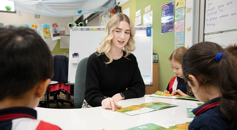 Teacher with her students in the classroom at St John XXIII College Stanhope Gardens