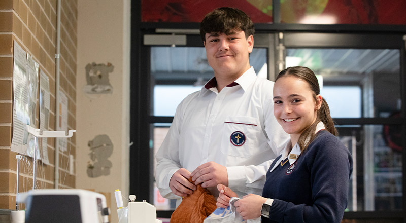 Students sewing together in the classroom at St John XXIII College Stanhope Gardens