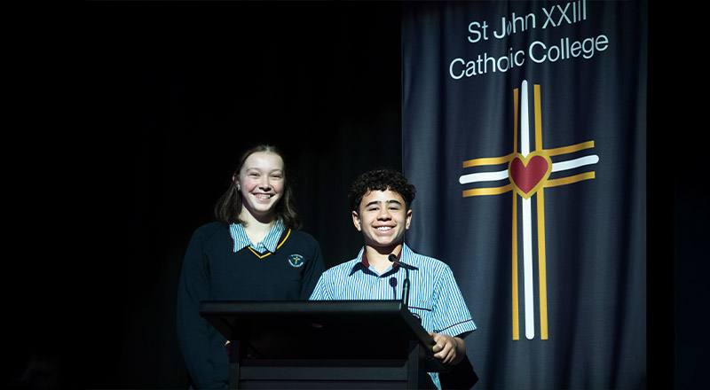 Students presenting during assembly at St John XXIII College Stanhope Gardens