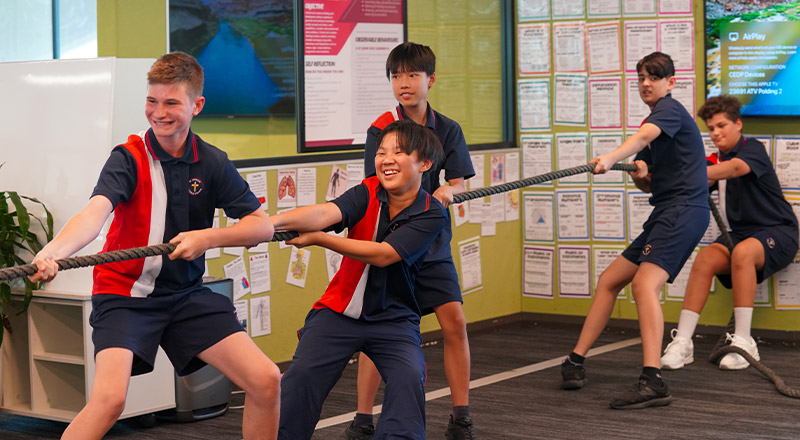 Students playing tug-o-war at St John XXIII College Stanhope Gardens