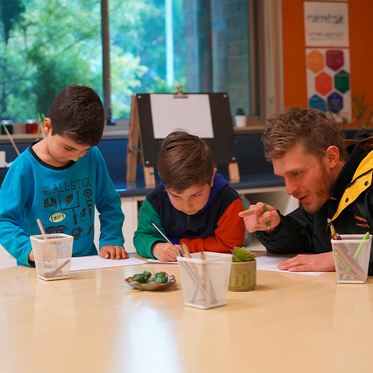 Students with their teacher at the early learning centre at St John XXIII College Stanhope Gardens