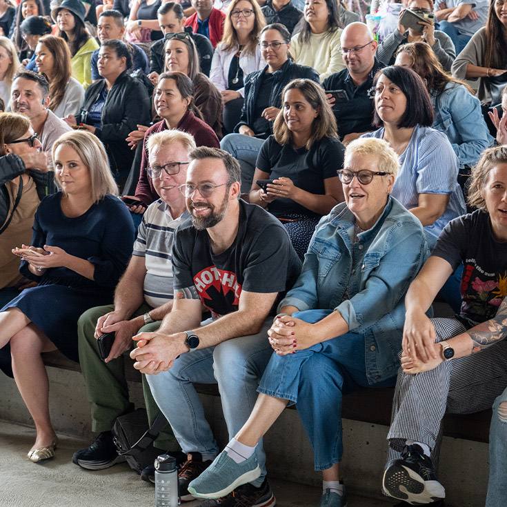 Parents in the audience at a school event at St John XXIII College Stanhope Gardens